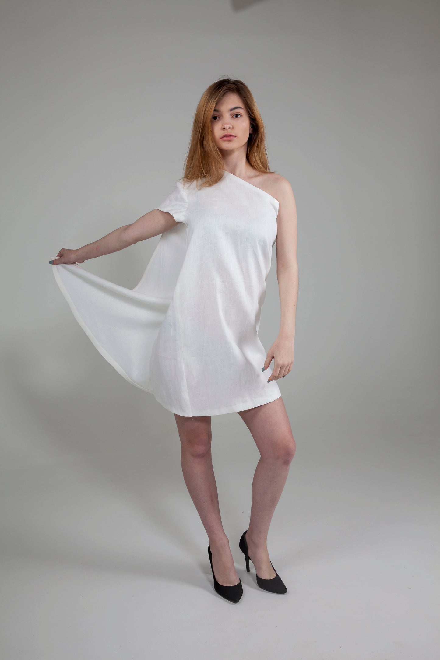 Anastasi Fashion design – Off the Shoulder Cape Dress (Front, Grabbing Side)