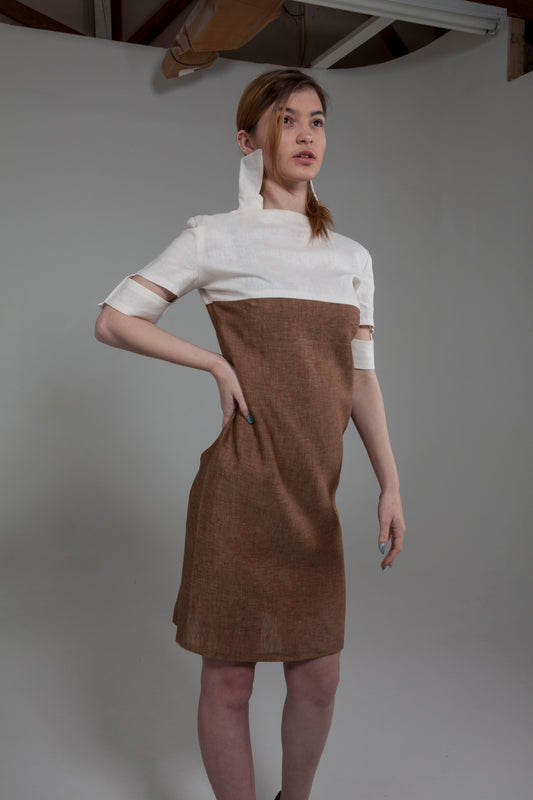 Anastasi Fashion design – Short Sleeve Cut-Out Dress (Side Stance): A short sleeve cut-out dress in brown and ivory colors, made from linen, displayed on a model.